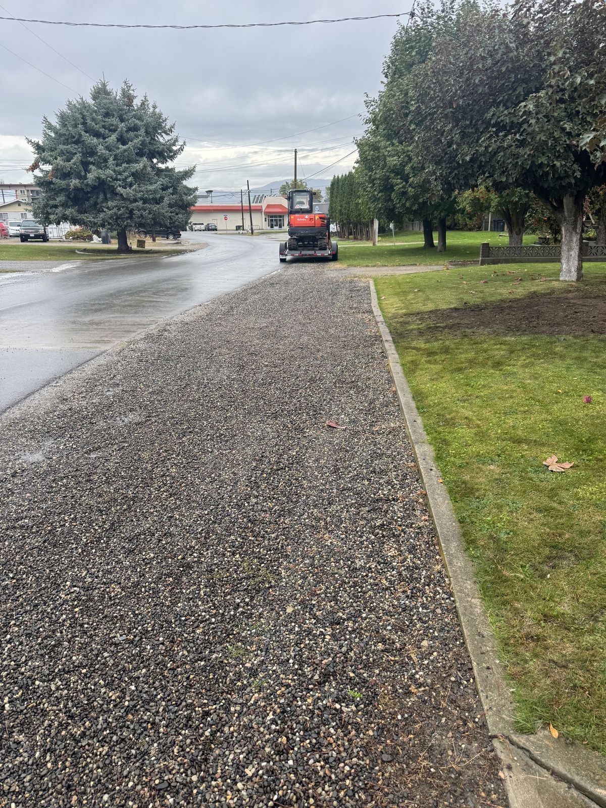 Fresh gravel walkway laid along a street